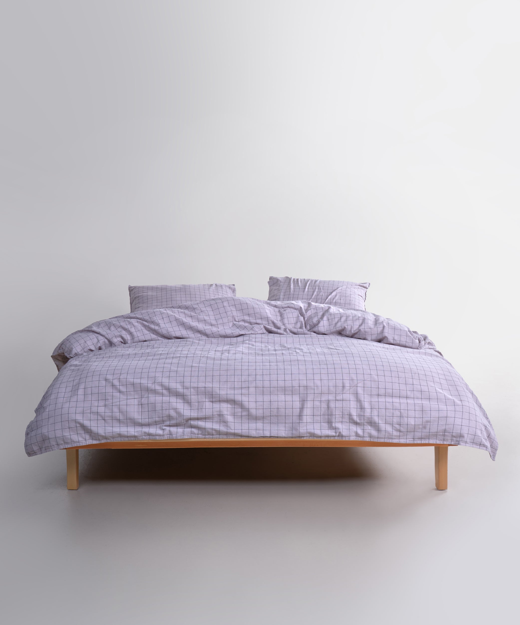 Styled full bed image featuring the Inara Natural Violet duvet cover set, adding a soothing and elegant touch to the bedroom.