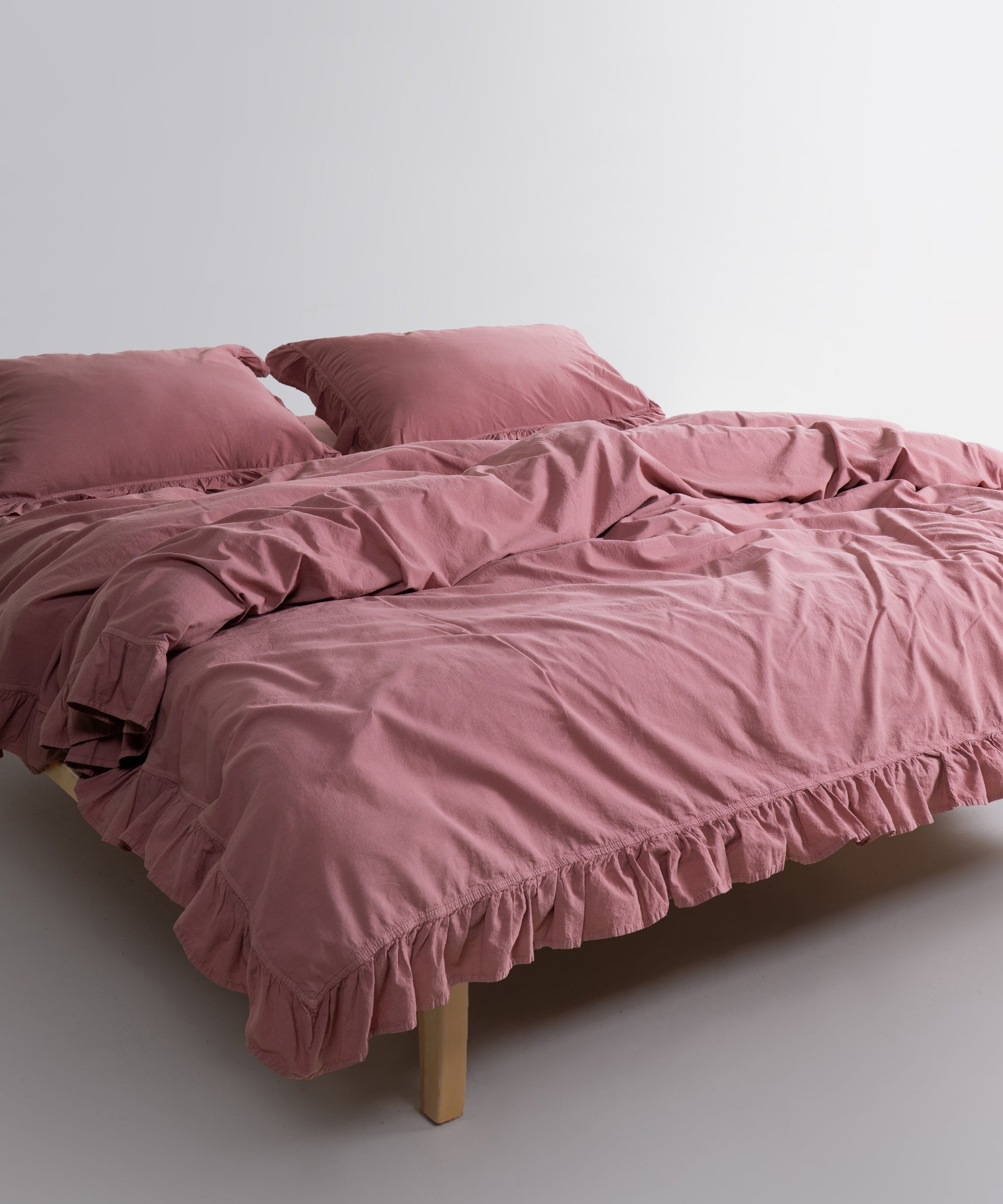 Old Rose cotton pillowcase with envelope closure and double stitched ruffle edge