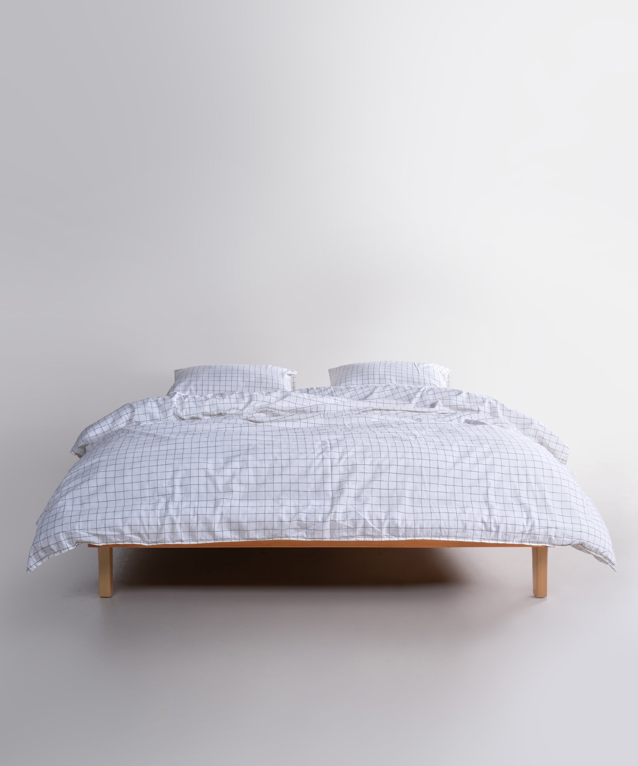 Styled full bed image featuring the Inara Snow White duvet cover set, creating a clean, calm and hotel-inspired bedroom atmosphere.