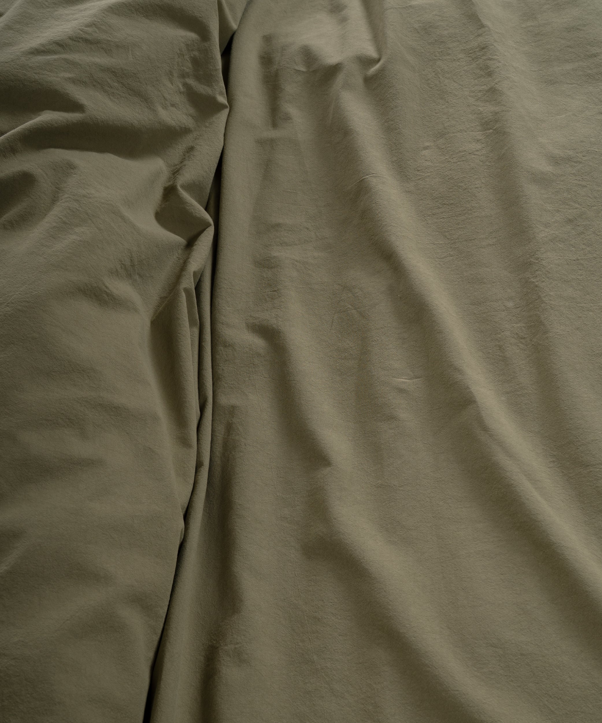 Soft Stonewashed Cotton Fabric | Olive Bedding Texture Detail
