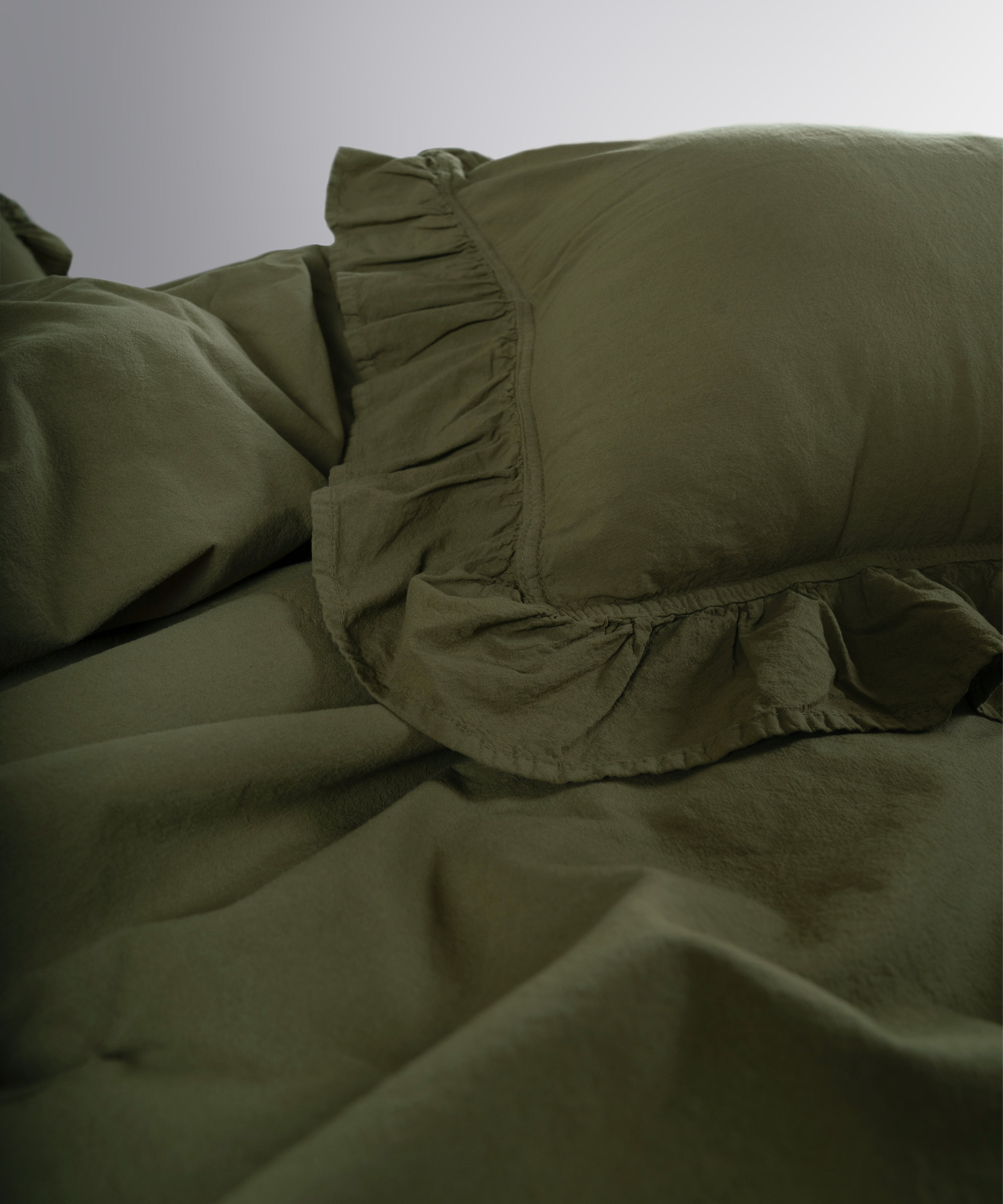 Ruffle detailed cotton pillowcases in Capulet Olive from Limasso stonewashed bedding collection