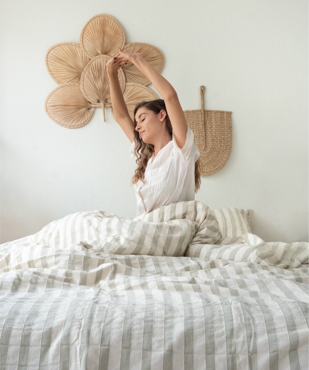 Natural light view of Green Wood striped cotton duvet cover set with airy and calm bedroom look