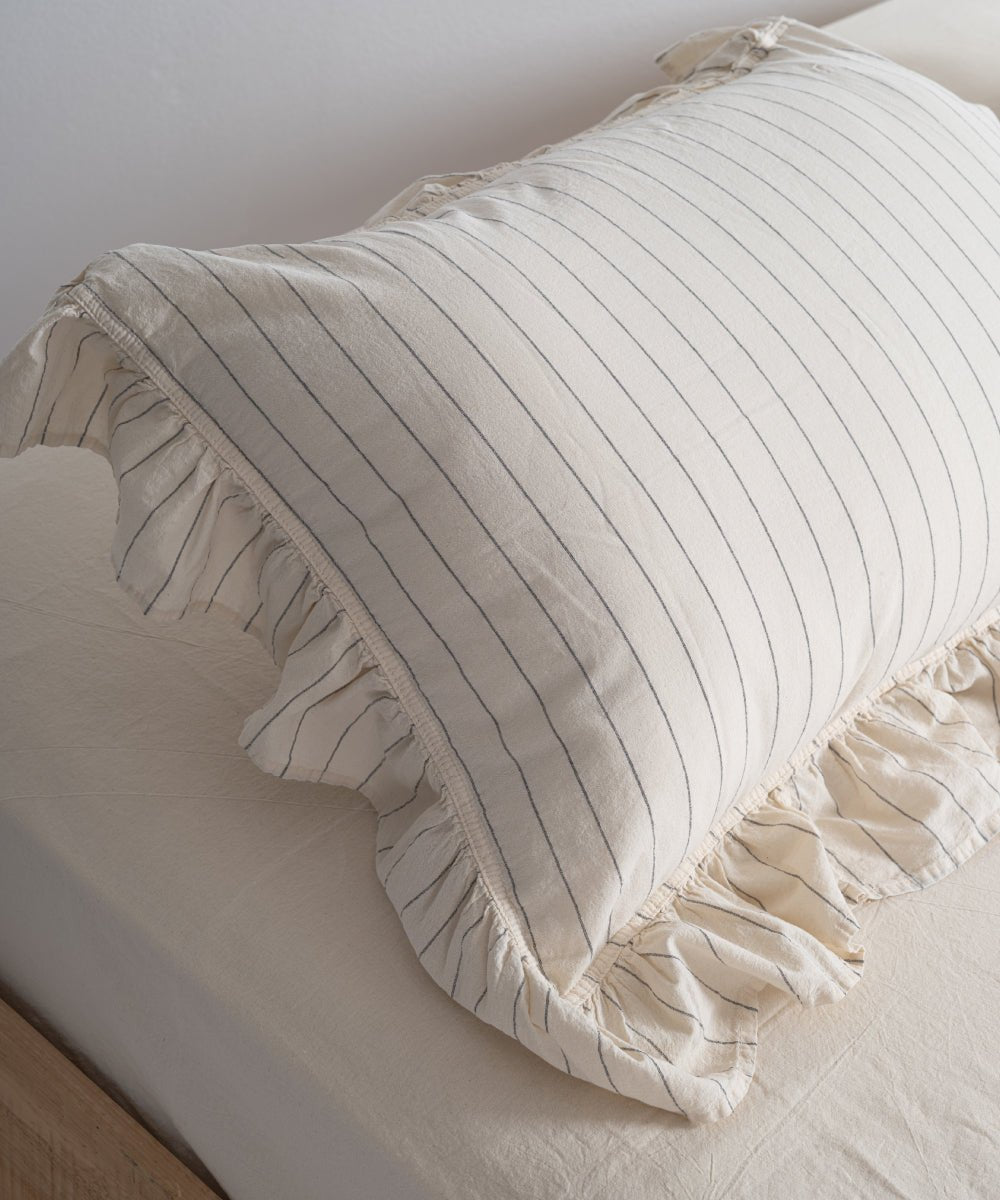 Leila garment washed cotton pillowcases with ruffled edges in natural cream and black stripe design
