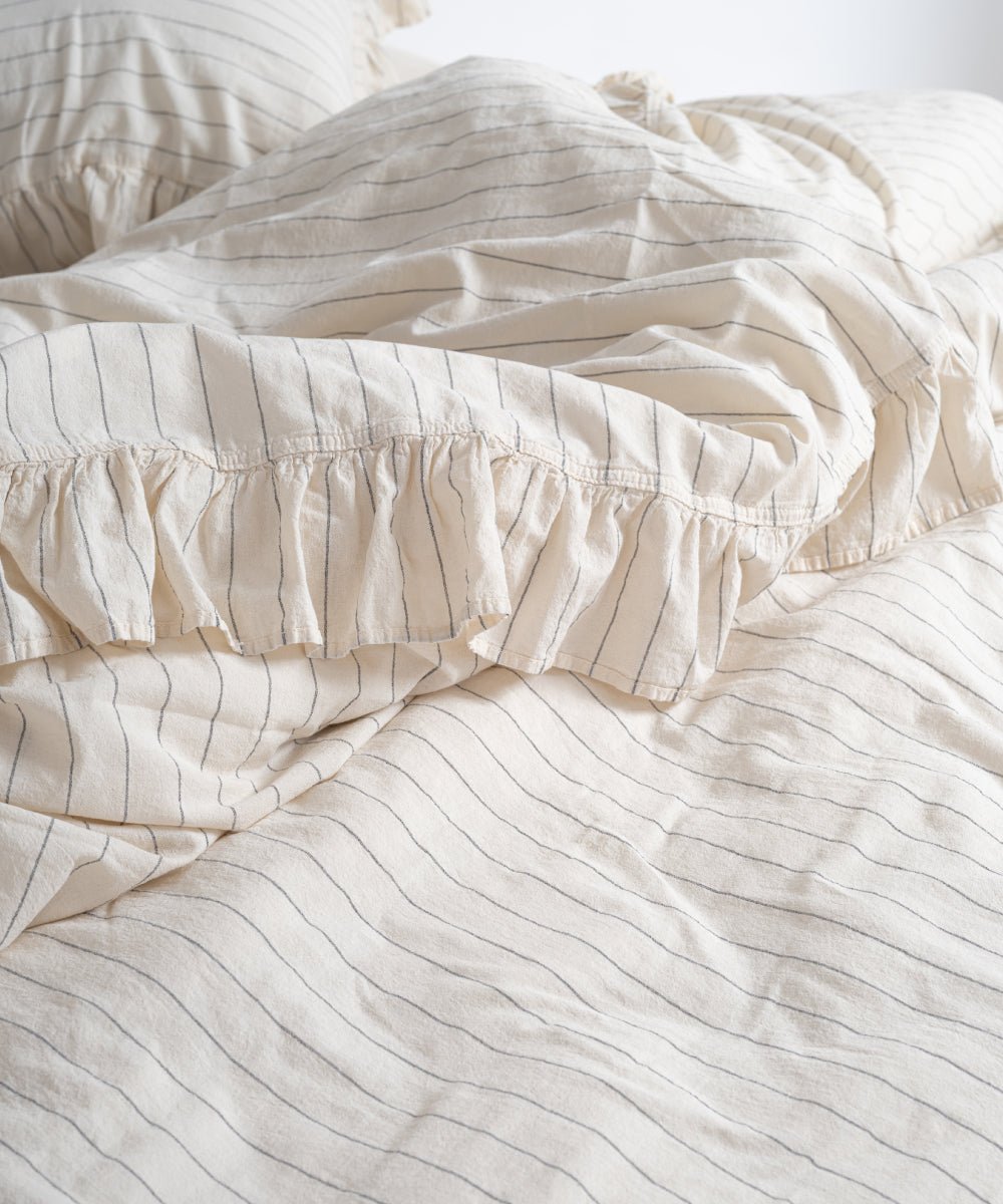 Close-up of Garmenwashed Leila 100% cotton duvet cover fabric showing black stripe texture