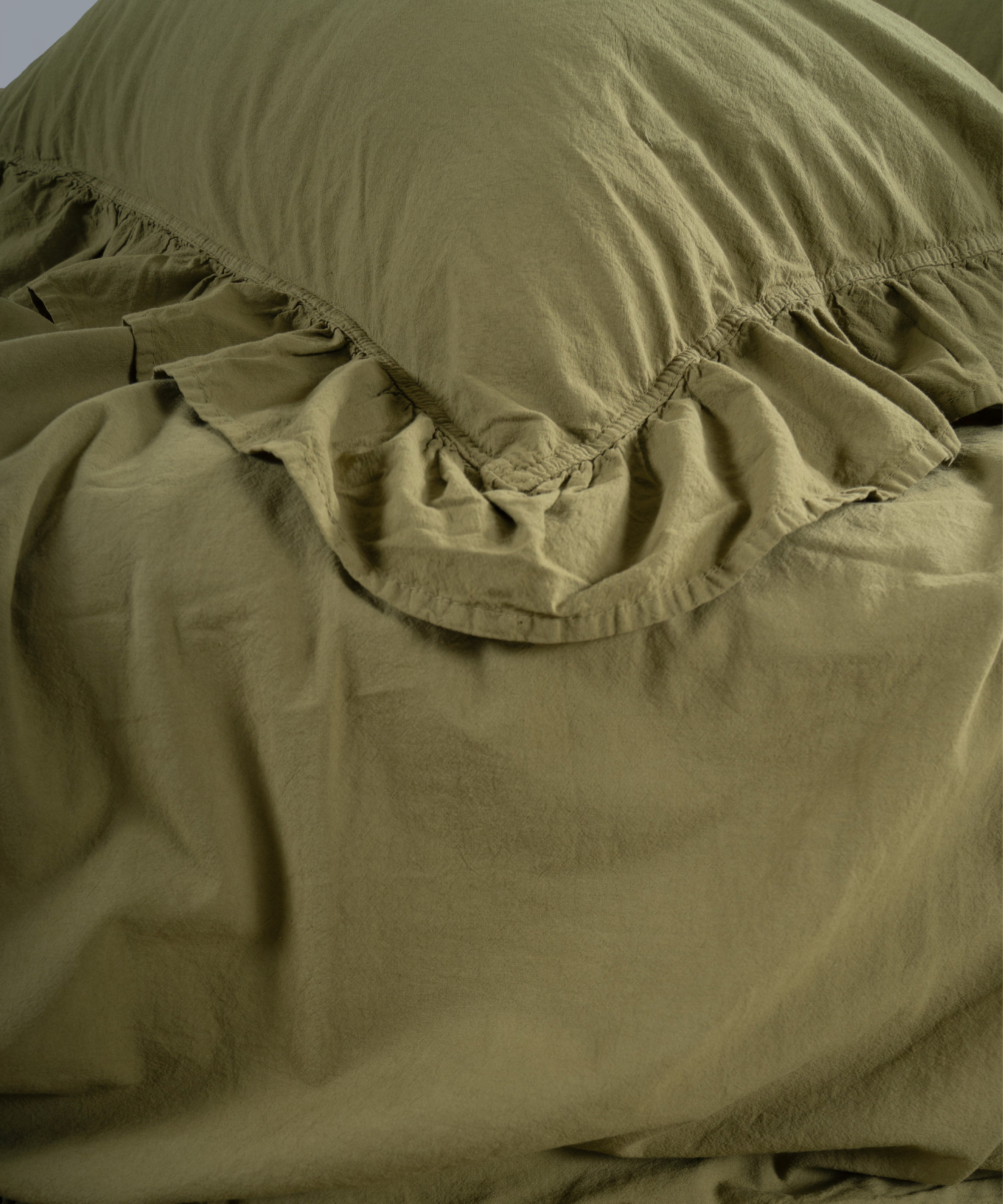 Olive green cotton pillowcase with envelope closure and ruffled trim