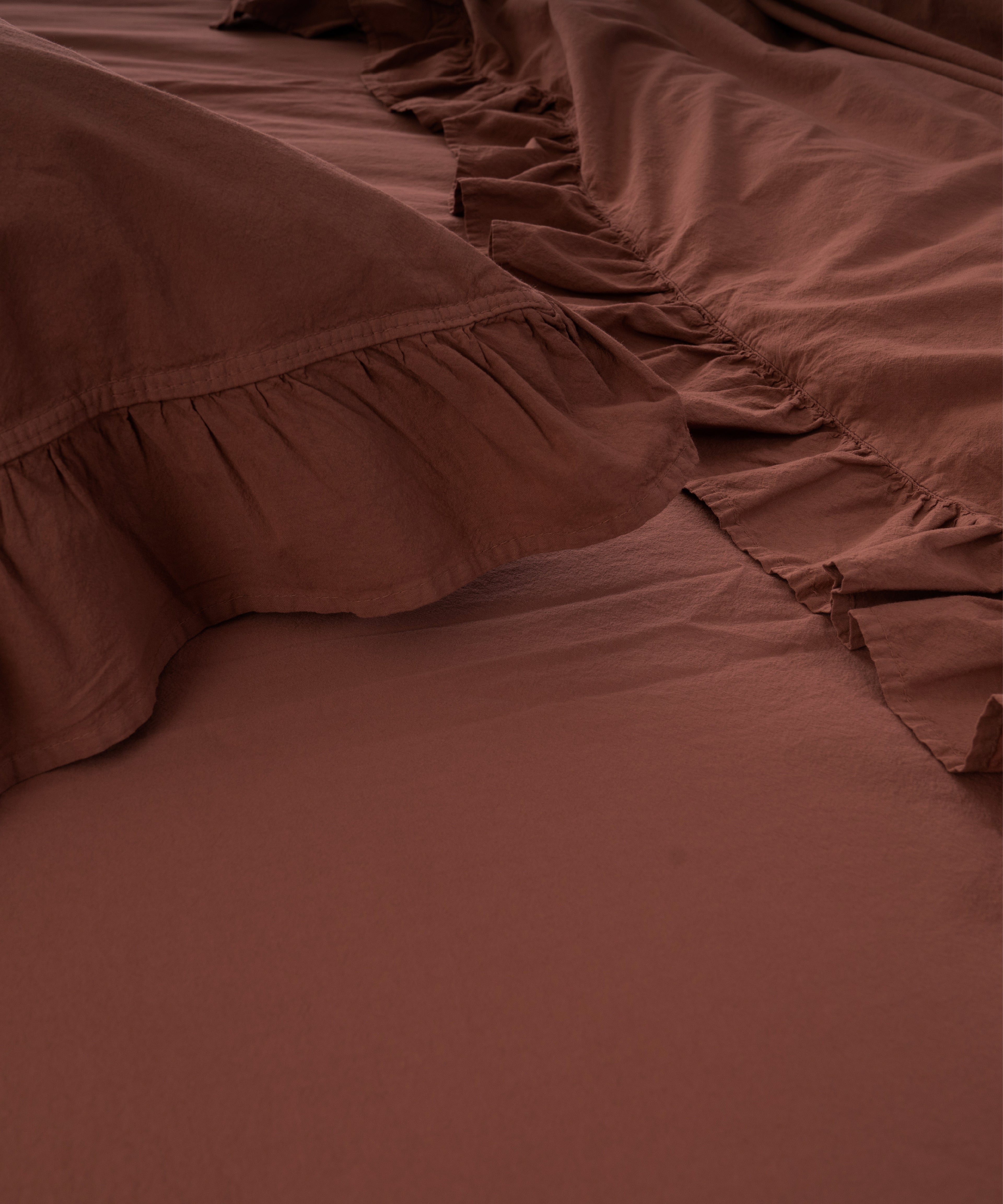 Close-up of stonewashed 100% cotton fabric in Cinnamon Stick showing soft texture and premium quality