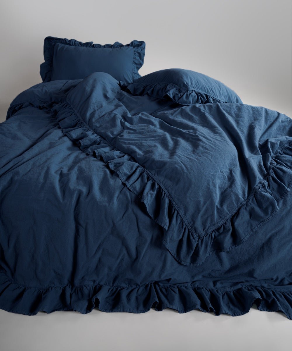 Close-up of stonewashed cotton fabric texture in dress blue duvet cover set