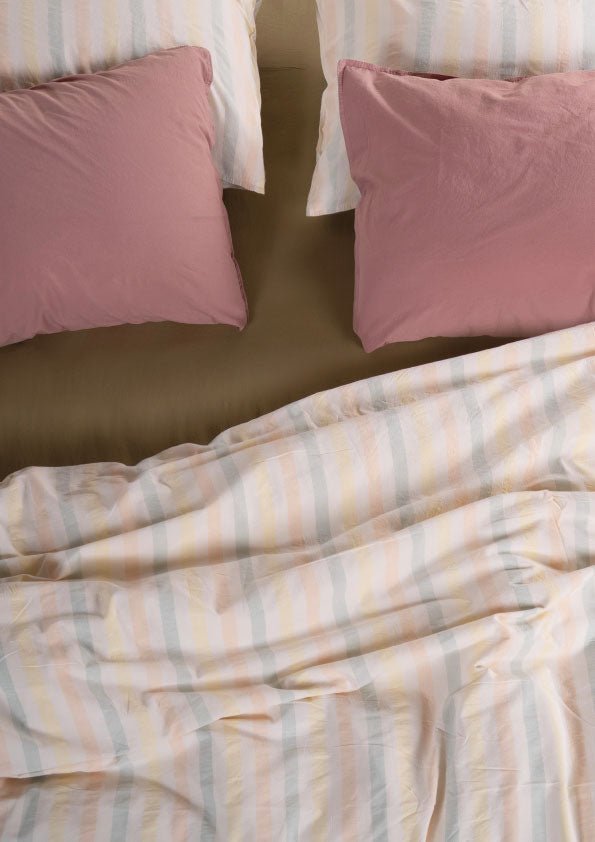 100% cotton duvet cover set with a soft, elegant tone creating a warm and relaxing bedroom atmosphere.