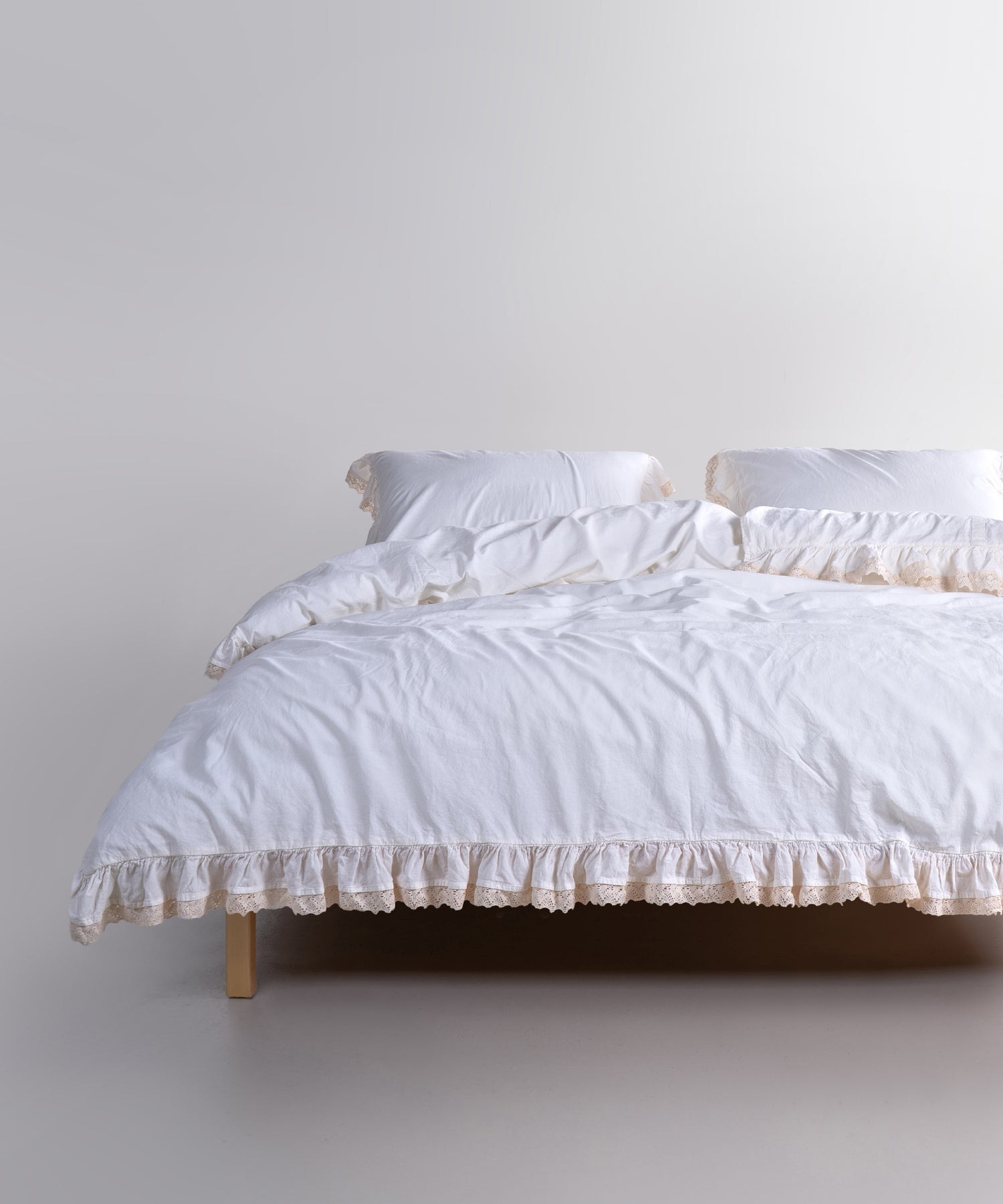 Delicate Lace &amp; Ruffle Detail for a Refined Bedroom