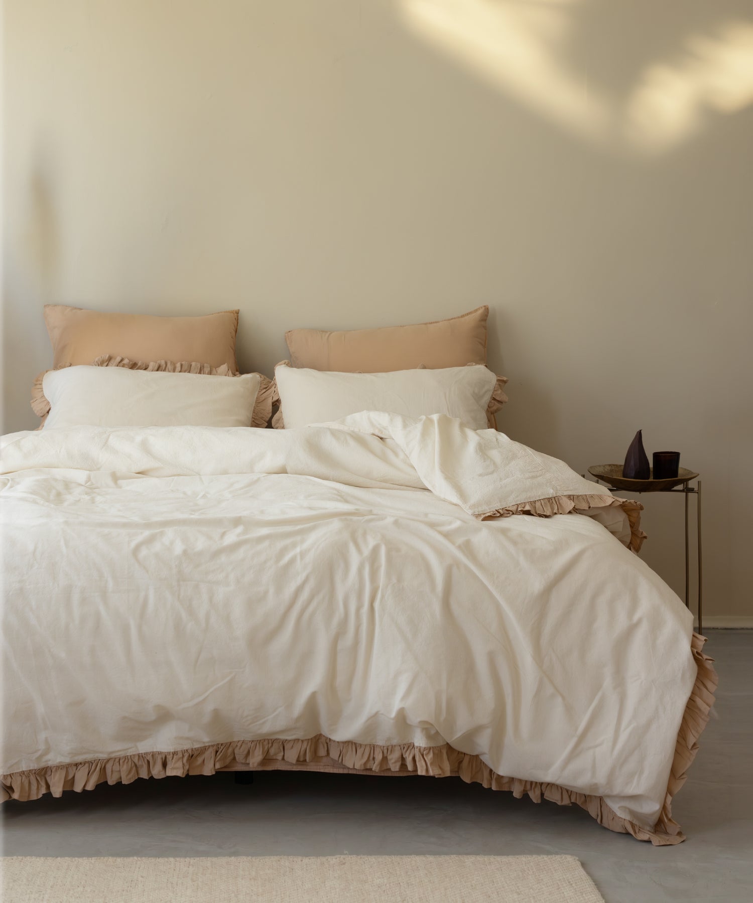 Odessia Olive Ruffled Stonewashed Cotton Duvet Cover Set in a sunlit bedroom with pristine pillowcases and pampas grass