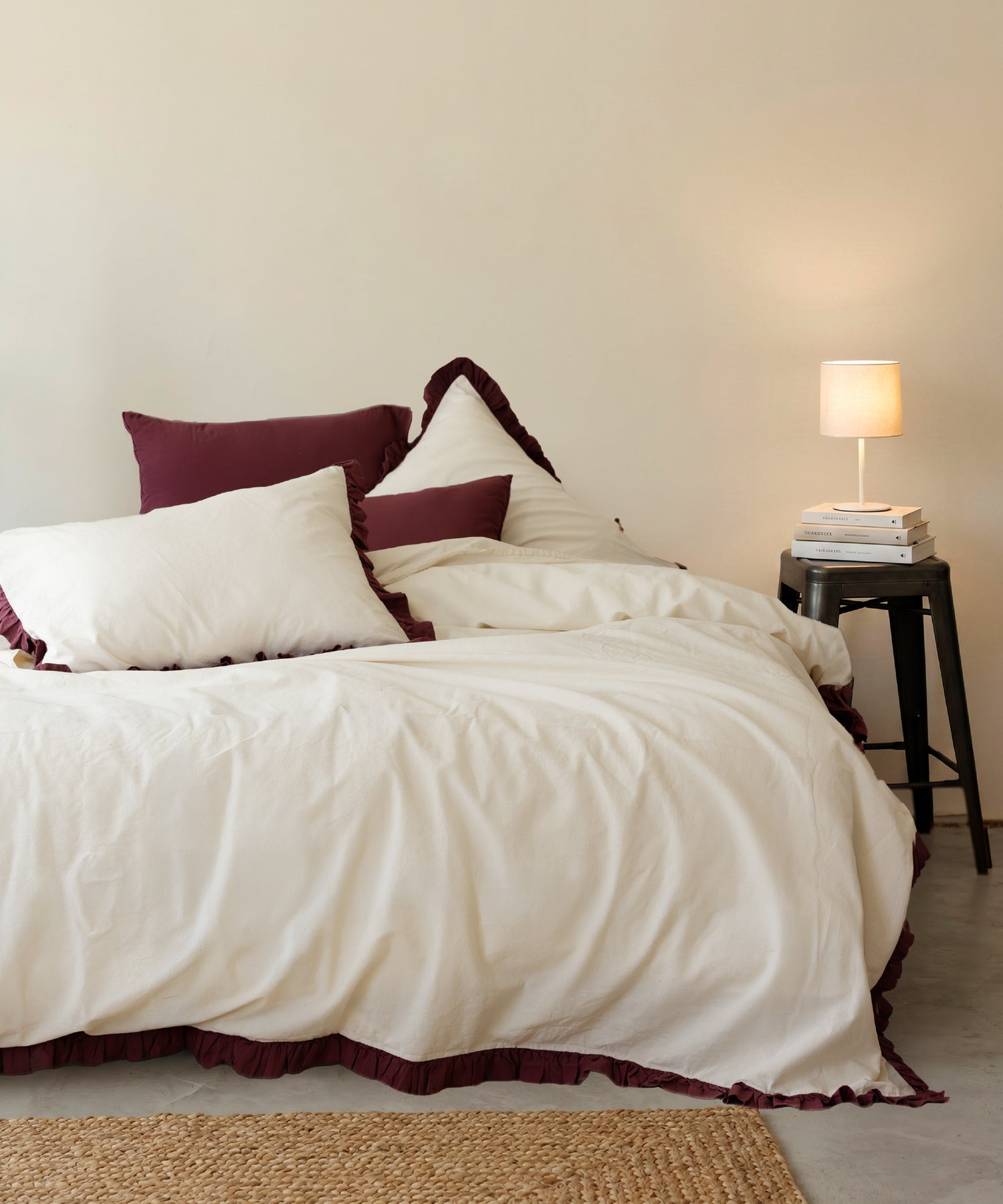 Odessia Raspberry Ruffled Stonewashed Cotton Duvet Cover Set styled in a warm bedroom with pristine pillowcases – Limasso