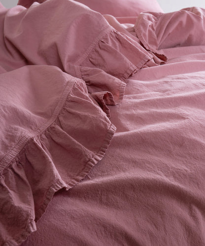Flowing stonewashed cotton fabric in Old Rose colour showing natural drape and breathable texture