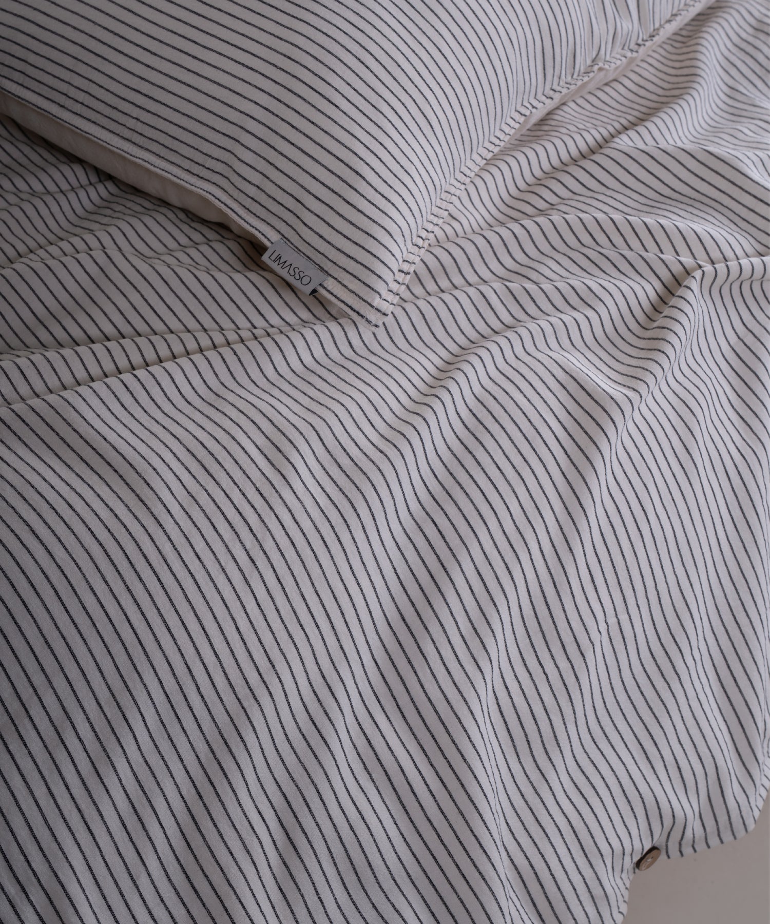 Classic button closure detail on garment washed 100% cotton duvet cover set
