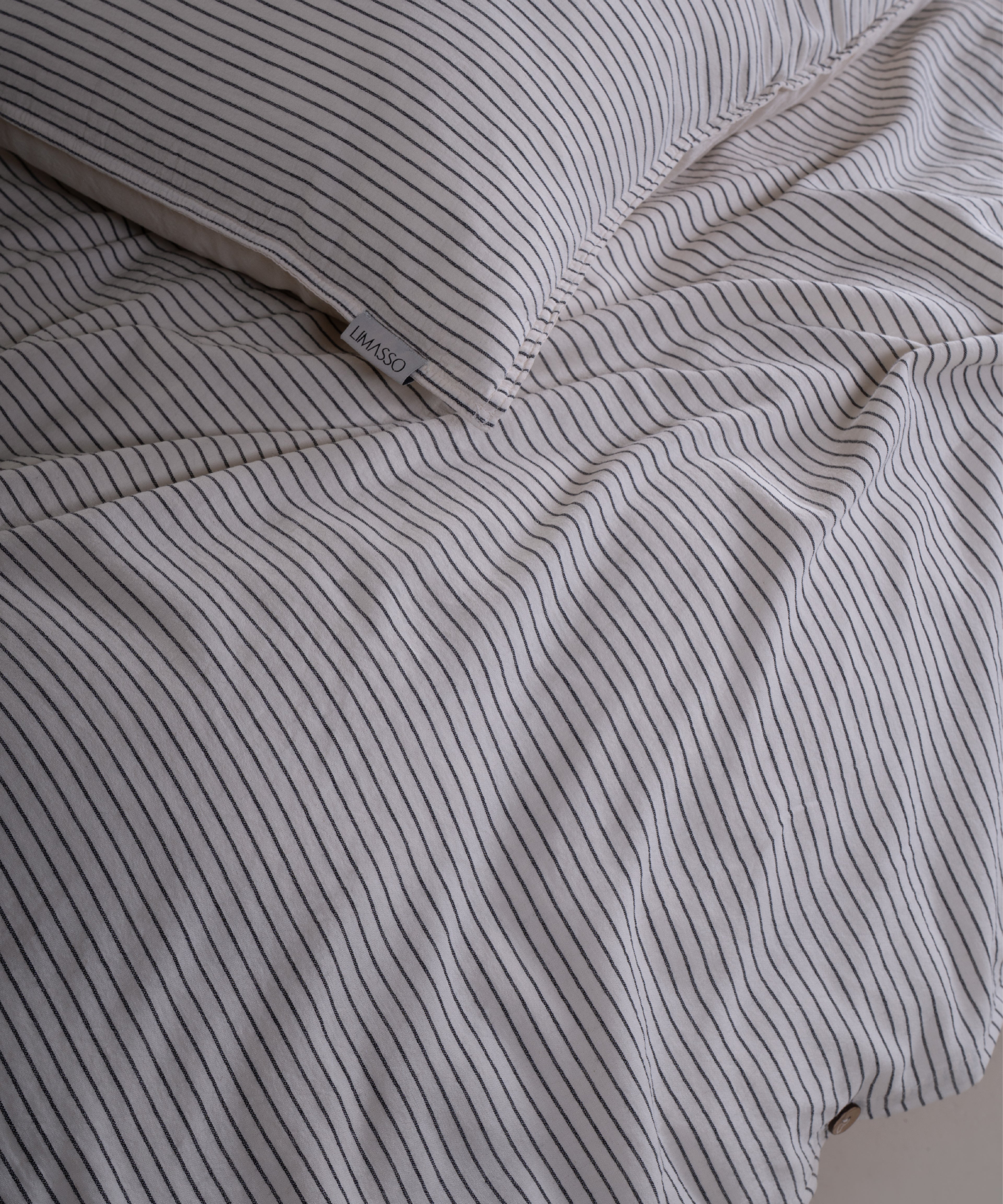 Classic button closure detail on garment washed 100% cotton duvet cover set