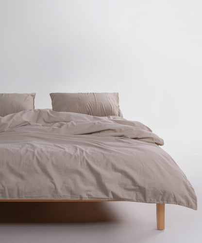 Breathable beige cotton pillowcases with envelope flap closure, set of two