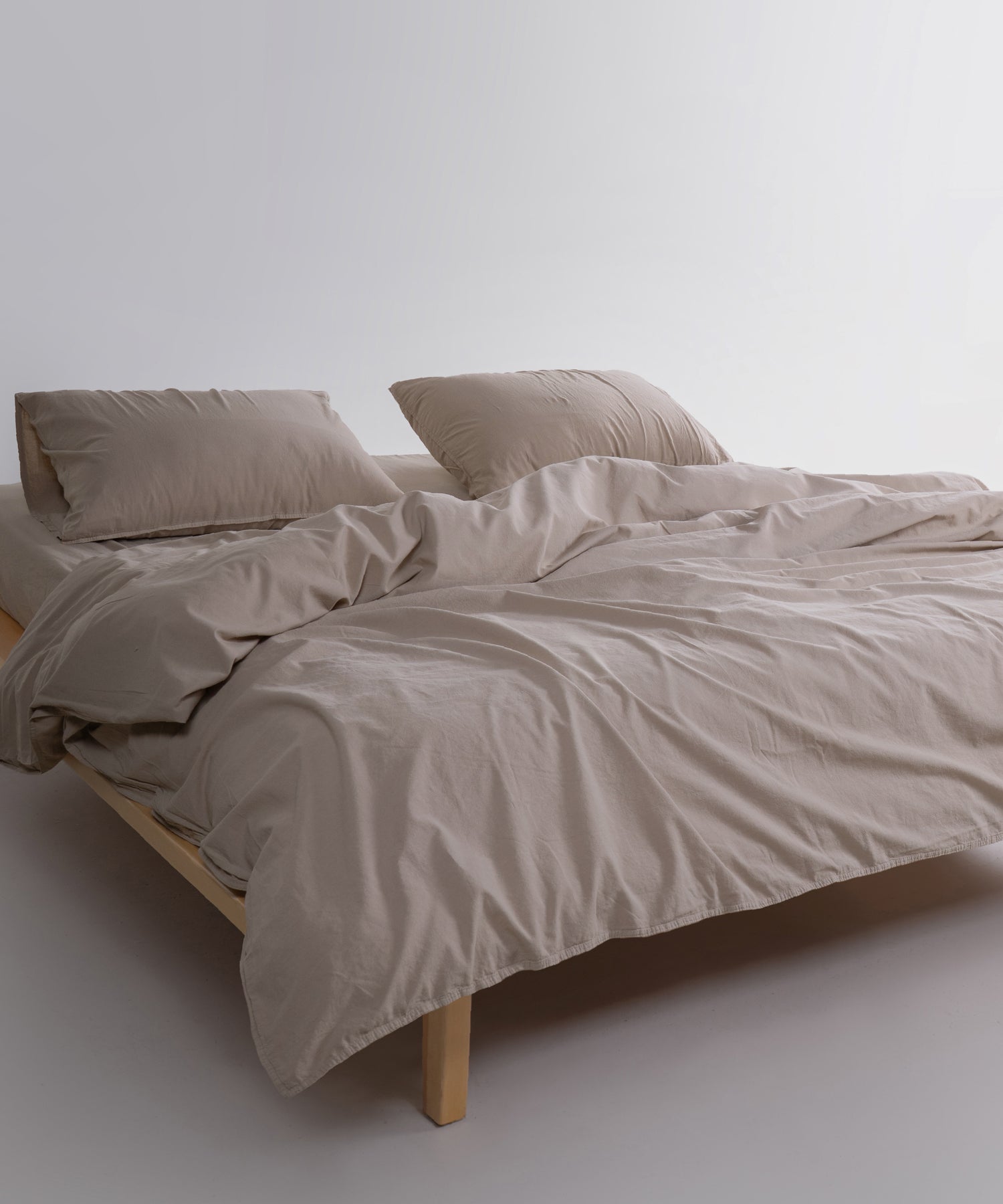 Stonewashed cotton duvet cover showing button closure and double-needle stitched edges for durability