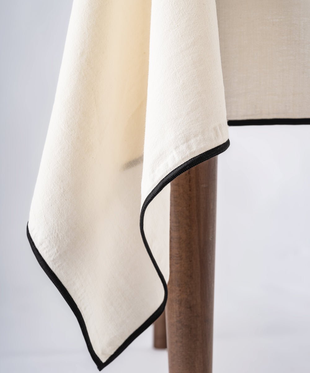 Cream embroidered cotton tablecloth styled on dining table with plates and decor, rectangular kitchen table cover UK