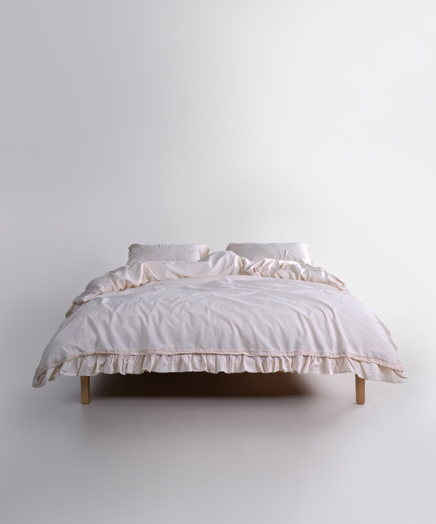Elegant cream duvet cover set made from stonewashed cotton, styled on a double bed. The soft neutral tone adds warmth, balance and a peaceful feel to modern and classic bedrooms.