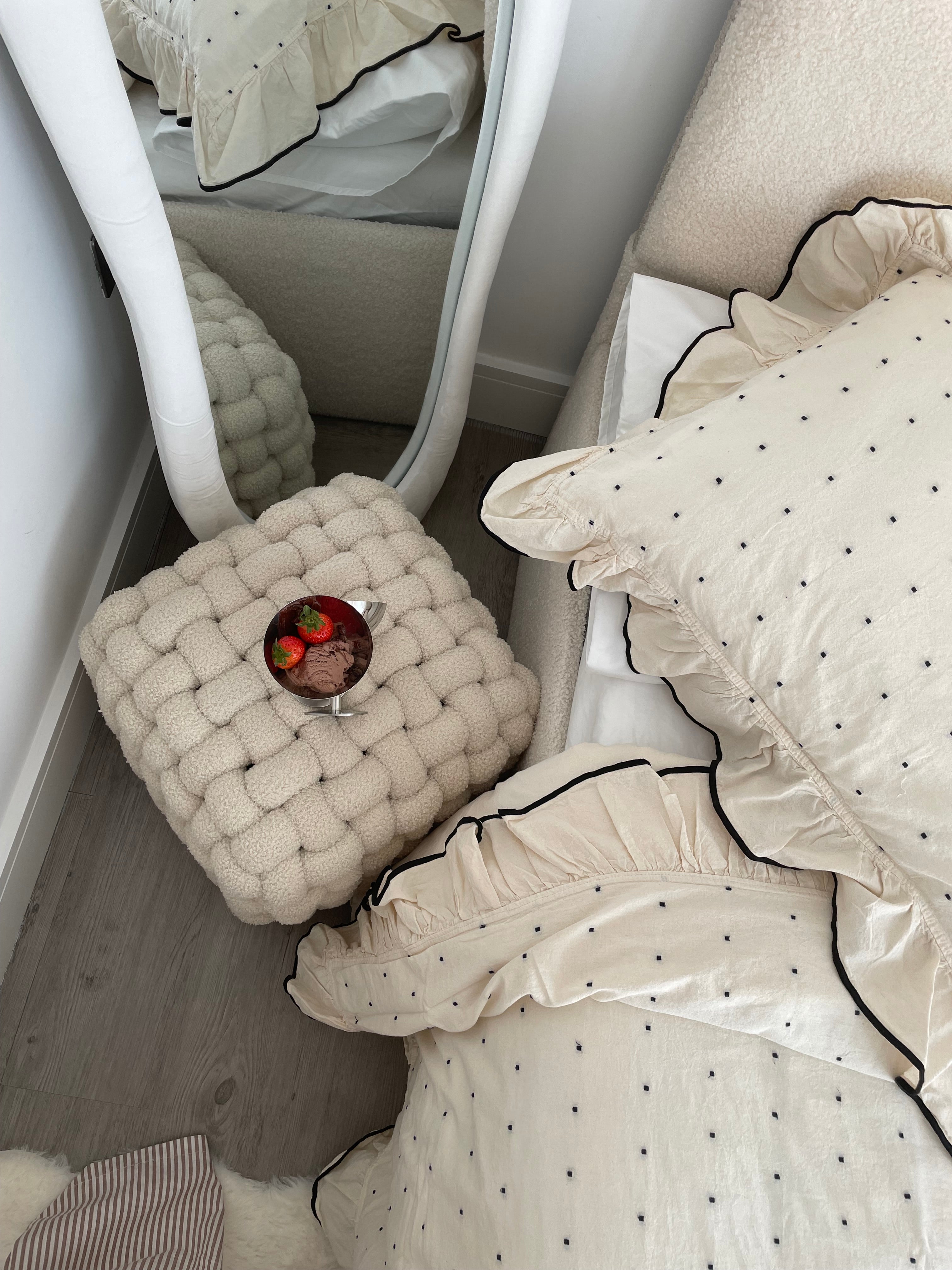 Customer bedroom styling photo featuring Limasso London cream cotton duvet cover set with black micro-dot pattern and ruffle edge detail
