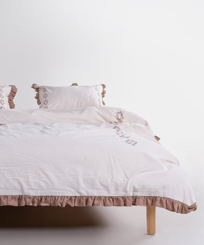 Elegant ruffle trim with hand embroidered detail