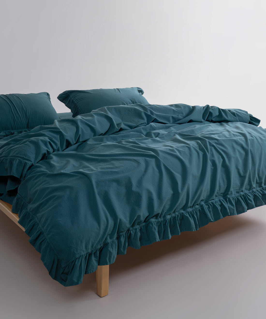 Dark green stonewashed cotton duvet cover set creating a calm and elegant bedroom look