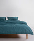 Stonewashed 100% cotton duvet cover set in dark green, creating a calm and natural bedroom look