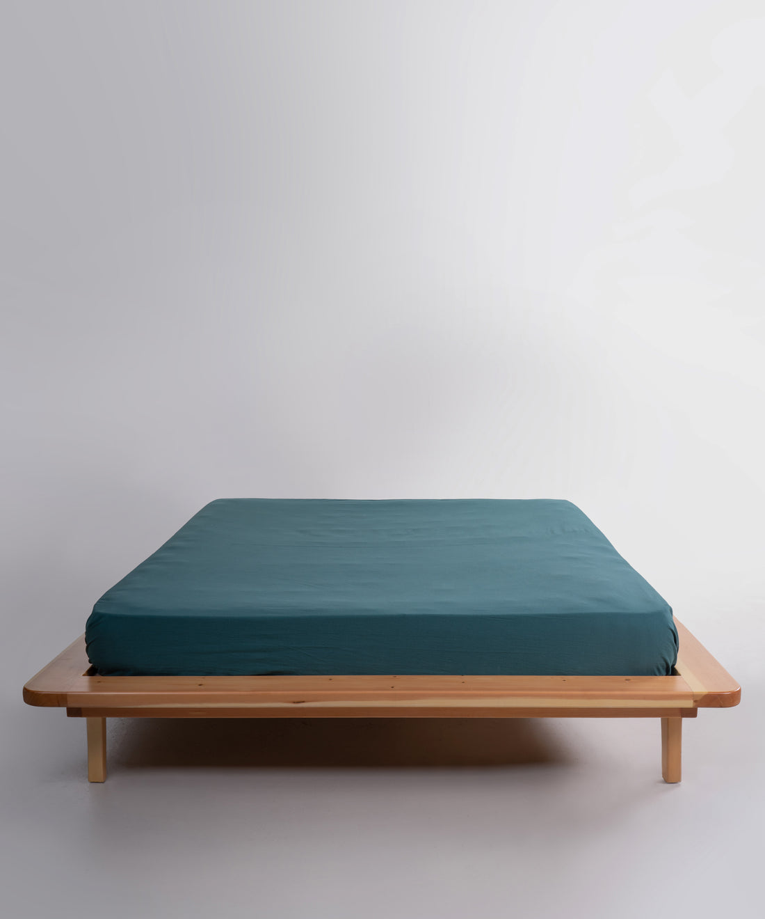 Stonewashed 100% soft cotton fitted sheet in dark green by Limasso London, designed for UK USA and Canada mattresses