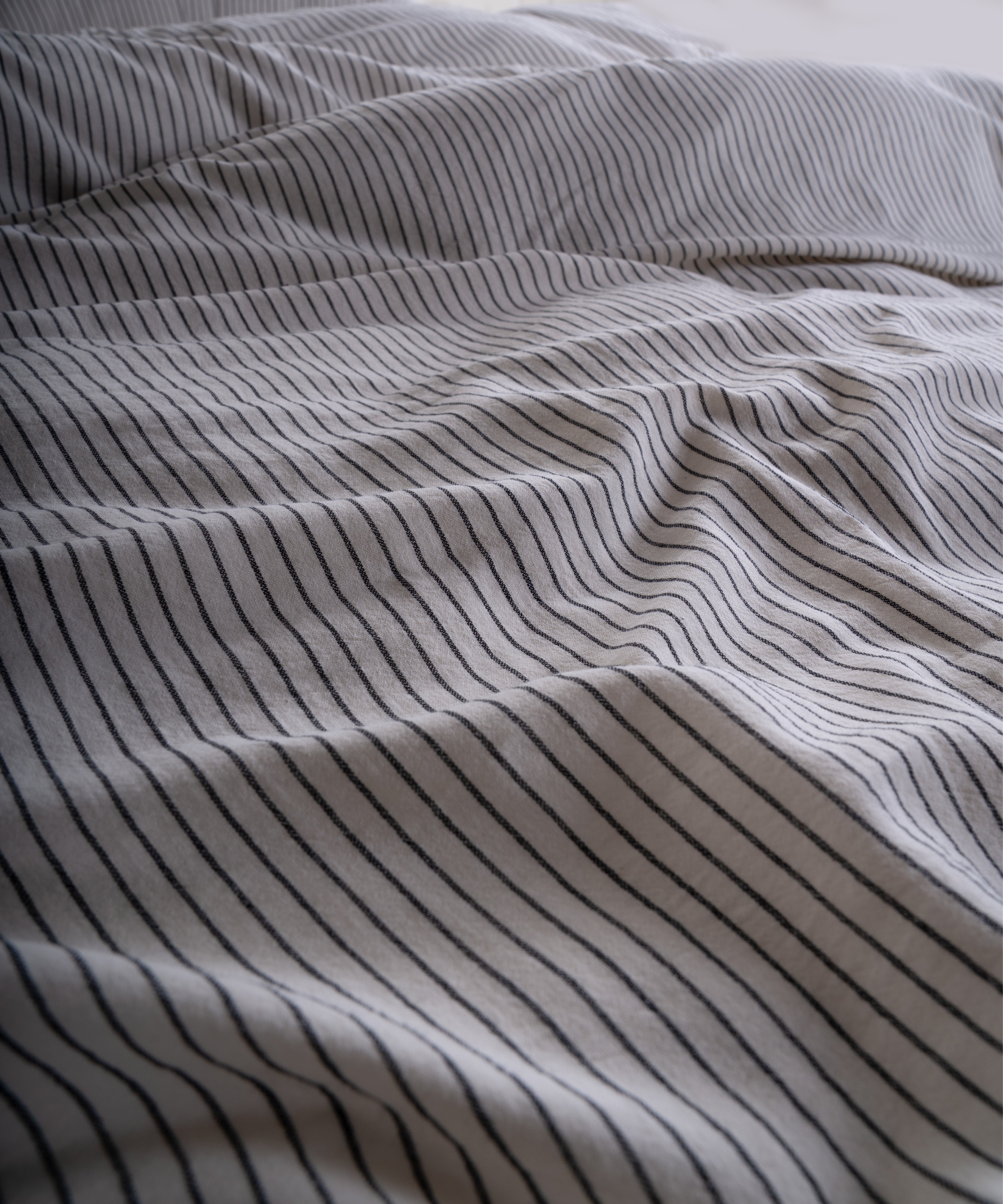 100% cotton pillowcase with envelope closure in cream and black stripe design