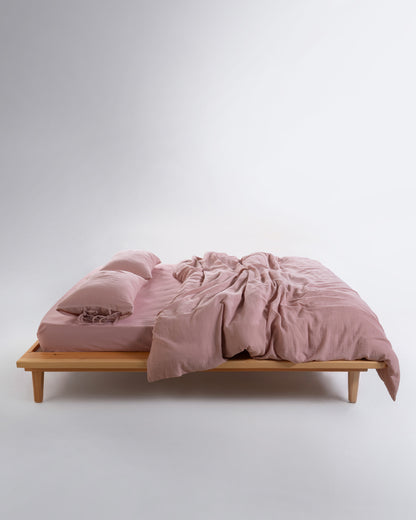 Side view of Esse Old Rose muslin cotton duvet cover set showing crinkle texture and natural drape – Limasso London