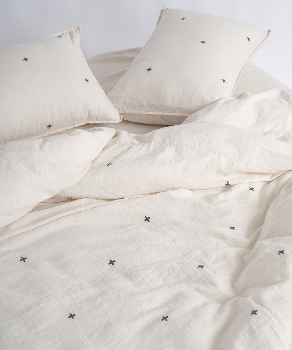 Soft natural cream cotton duvet cover set featuring modern black cross pattern, breathable and garment washed for everyday comfort