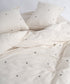 Soft natural cream cotton duvet cover set featuring modern black cross pattern, breathable and garment washed for everyday comfort