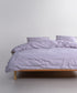 Main view of the Inara duvet cover set in Natural Violet, made from 100% stonewashed cotton with a soft, relaxed finish.