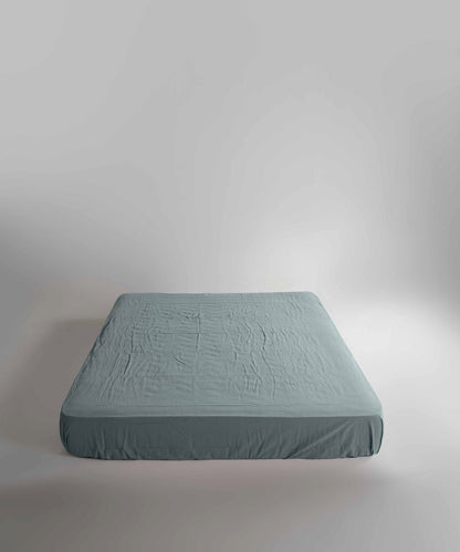 Natural Green fitted sheet made from 100% stonewashed cotton. Features elasticated edges, a smooth relaxed finish and a secure fit for deeper UK mattresses.