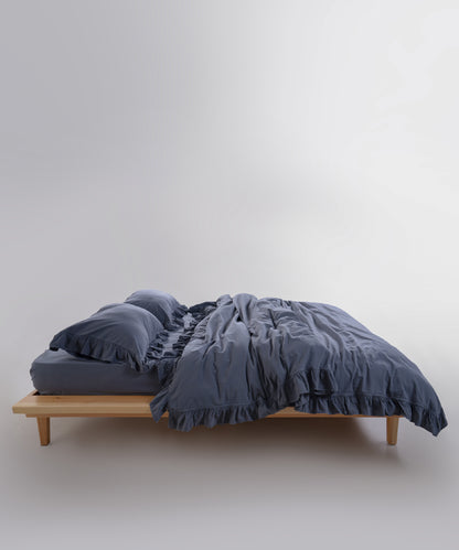 stonewashed cotton pillowcases styled on a UK bed, creating a calm and elegant bedroom atmosphere