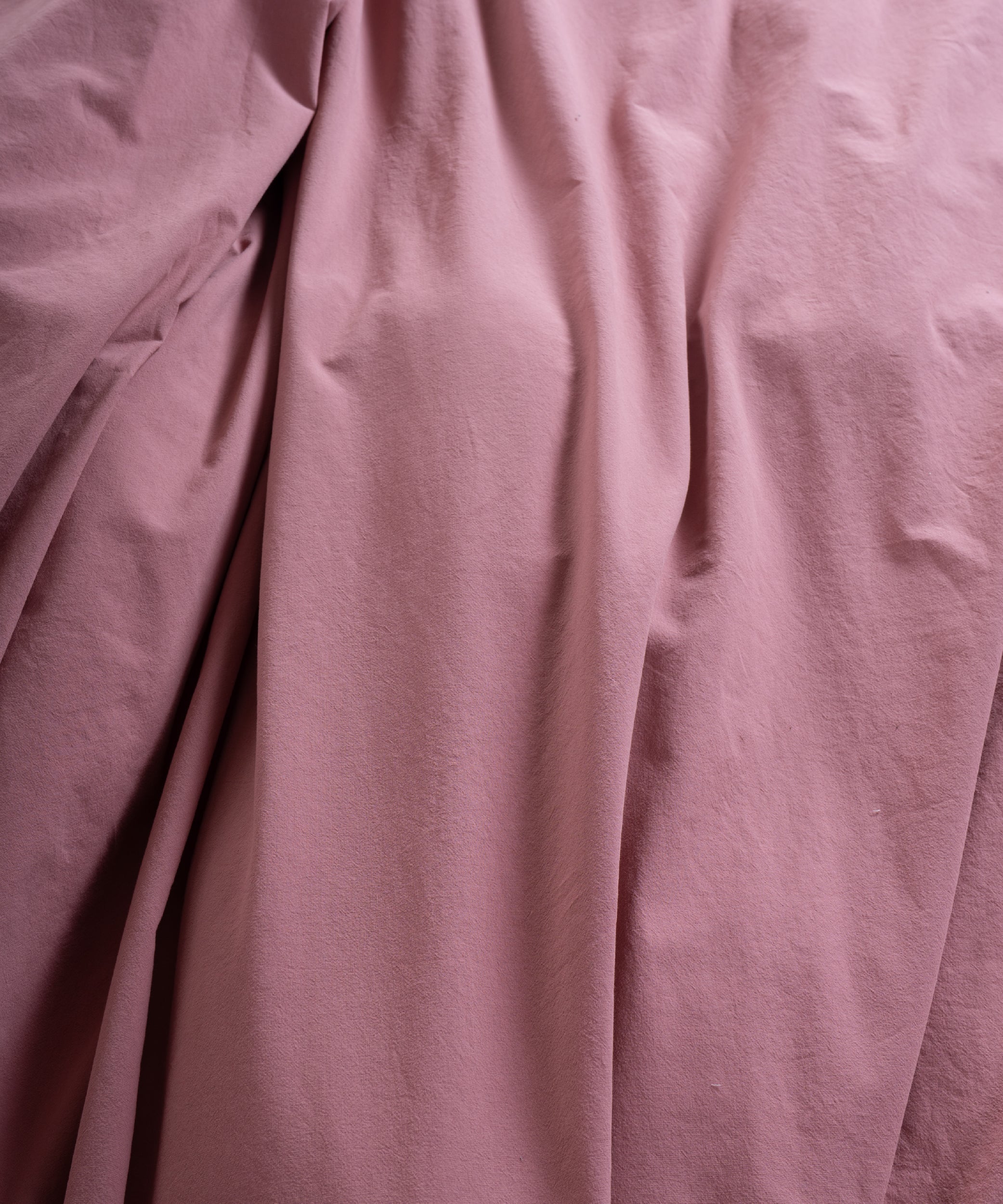 Old Rose stonewashed cotton bedding set styled in neutral UK bedroom interior with soft natural light