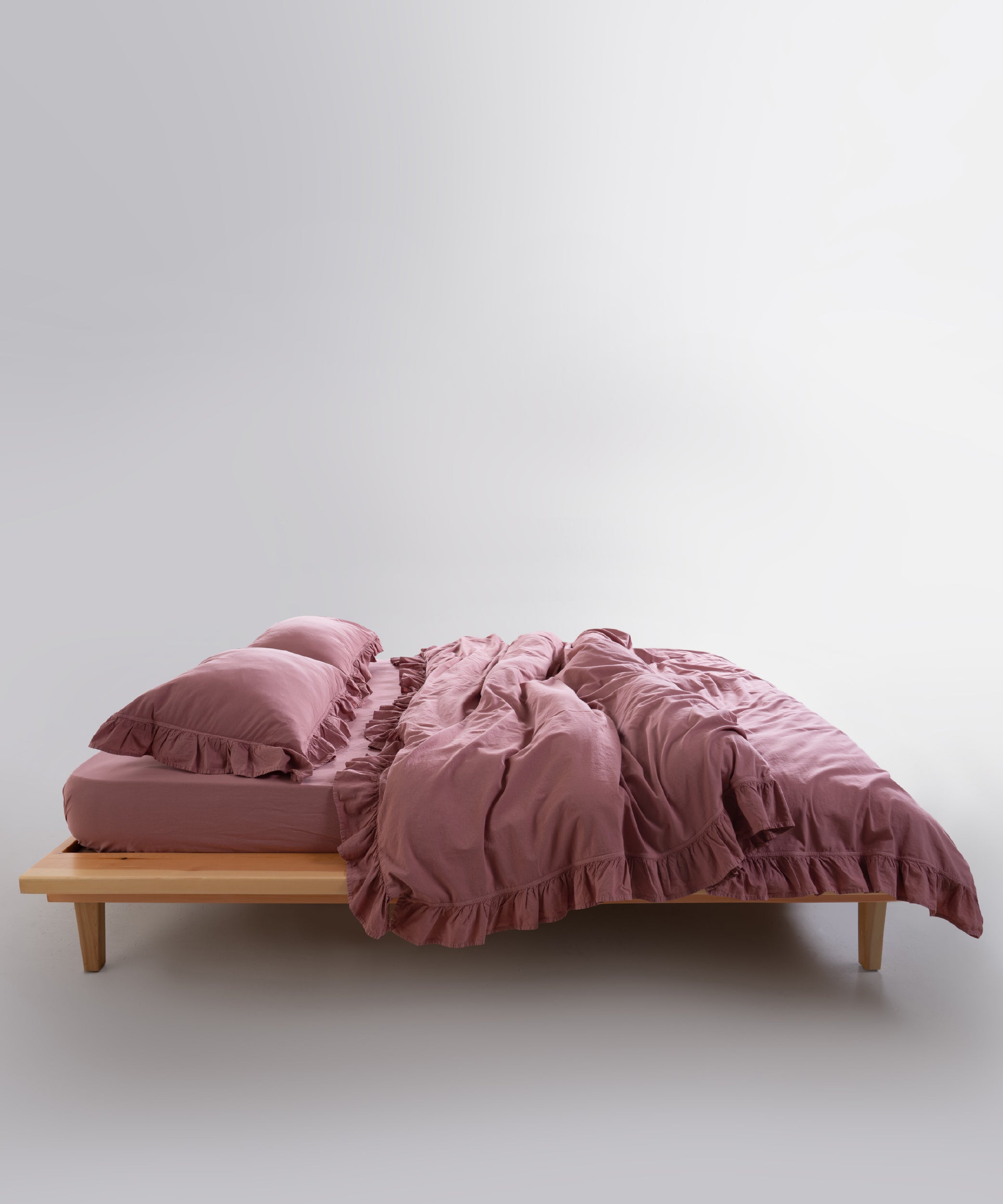 Stonewashed Old Rose cotton duvet cover set styled in modern neutral bedroom interior