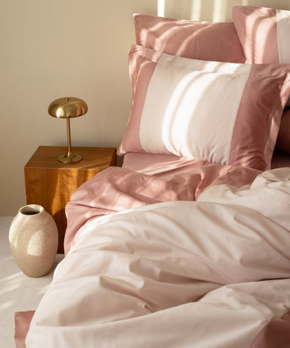 210TC Sateen Duvet Cover Set Old Rose and Pale Mauve angled view with brass lamp and ceramic vase – Limasso London