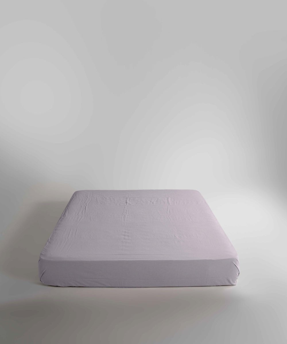 Soft stonewashed cotton fitted sheet in Opal Grey. A versatile neutral shade that complements modern and minimalist bedrooms, available in all UK sizes with deep mattress depth options.