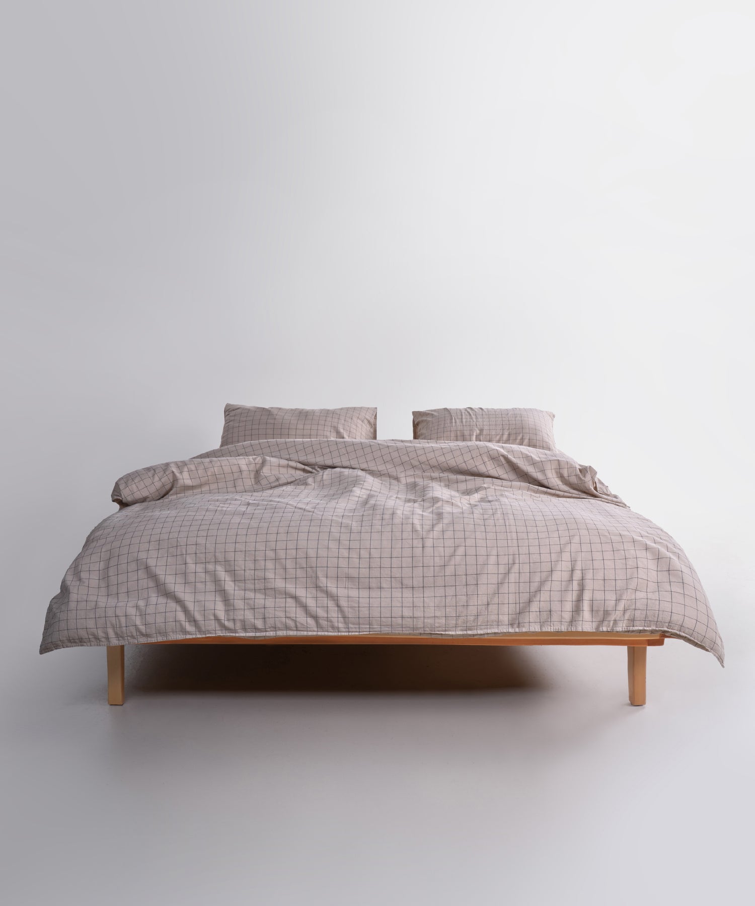 Styled full bed image featuring the Inara Oxford Tan duvet cover set, creating a cosy, calm and earthy bedroom atmosphere.