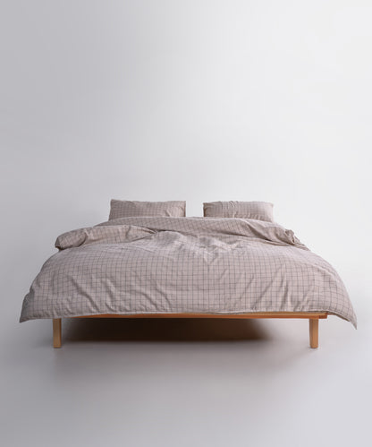Styled full bed image featuring the Inara Oxford Tan duvet cover set, creating a cosy, calm and earthy bedroom atmosphere.