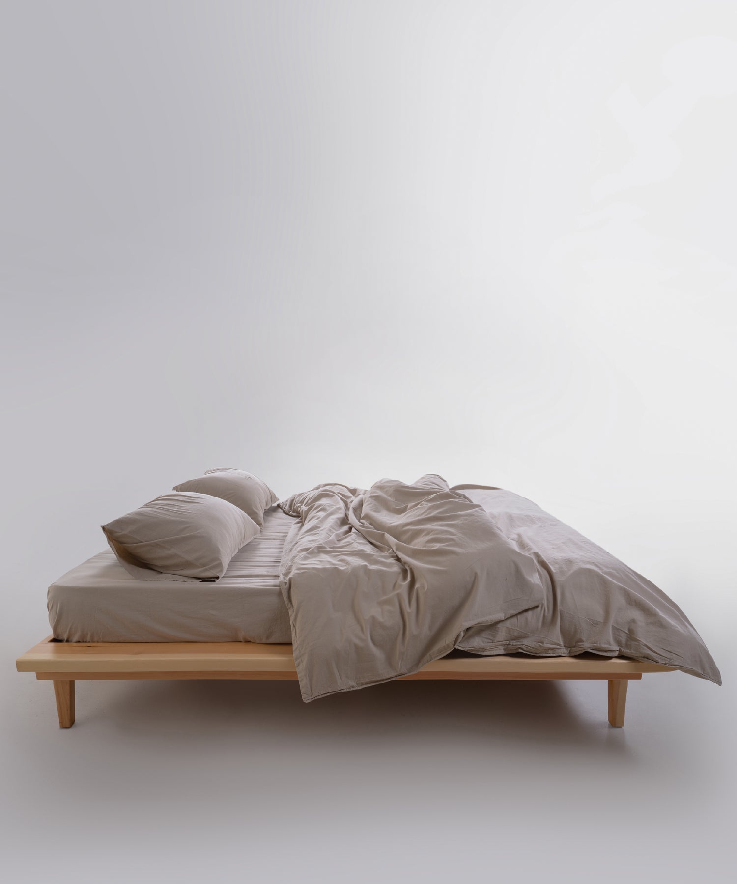 Close-up of stonewashed 100% cotton fabric in oxfordtan beige with relaxed natural texture