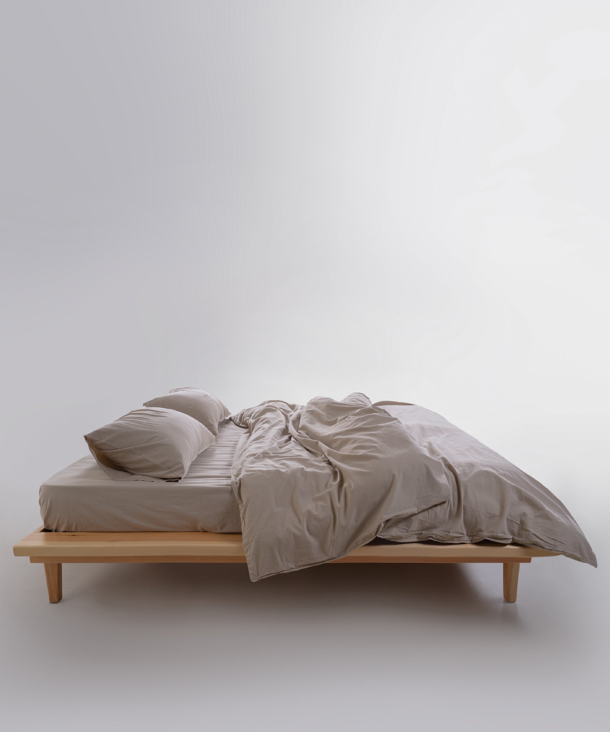 Close-up of stonewashed 100% cotton fabric in oxfordtan beige with relaxed natural texture