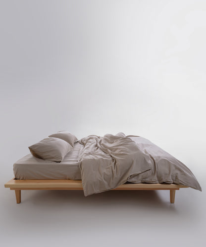 Close-up of stonewashed 100% cotton fabric in oxfordtan beige with relaxed natural texture