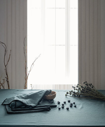 Premium stonewashed 100% cotton tablecloth in dark green colour, durable embroidered dining table cover for everyday use