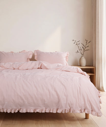 Pristine cotton pillowcase with envelope closure and elegant ruffled edge detail