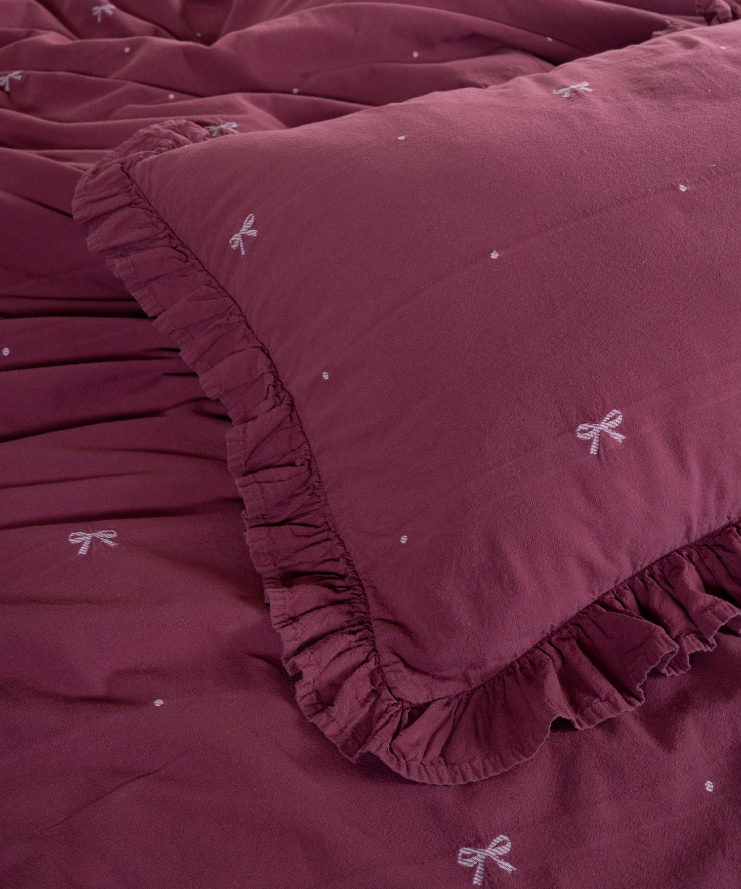 Raspberry cotton pillowcase with envelope closure and elegant ruffled edge detail