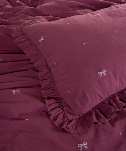 Raspberry cotton pillowcase with envelope closure and elegant ruffled edge detail