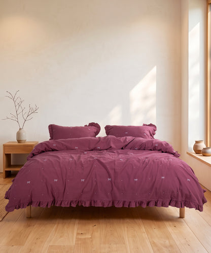 Stonewashed Raspberry cotton duvet cover set styled in warm and stylish UK bedroom interior