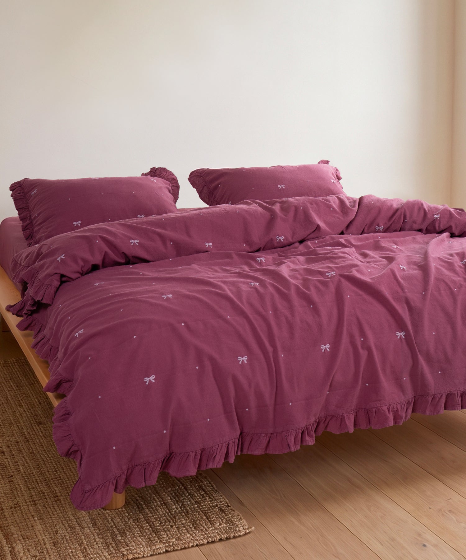 Close-up of stonewashed 100% cotton fabric in Raspberry showing soft breathable texture