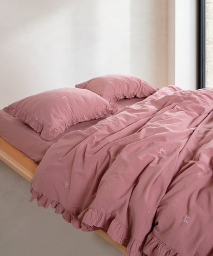 Stonewashed old rose cotton duvet cover set with jacquard ribbon and ruffled edge detail – Limasso London